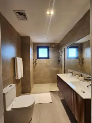 a bathroom with a toilet and a sink at Luxury Beachside Retreat & Private Plunge Pool in Punta Cana