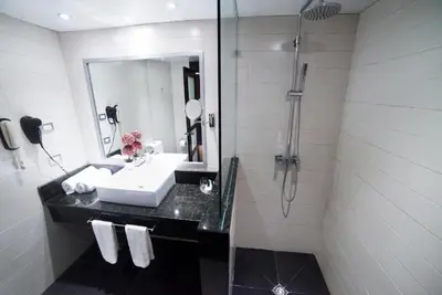 a bathroom with a sink and a shower at LTH Las Terrenas Hotel in Las Terrenas
