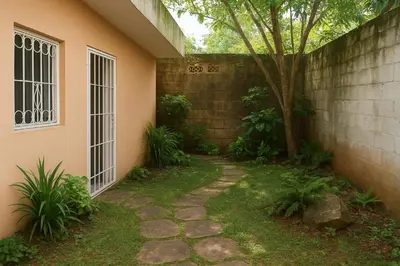 a walkway in front of a house with a tree at Relaxing and Serene Guest Room in Cancino