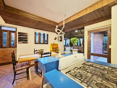 a kitchen with a stove and a blue counter top at Teonil in Jarabacoa