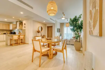 a dining room and kitchen with a table and chairs at Luxury apartment in hard rock punta cana in Punta Cana