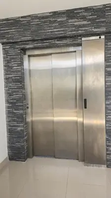 a large metal elevator doors in a building at Nuevo Apartamento en Bayahibe in Bayahibe