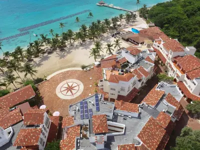 an aerial view of a house on the beach at Cadaques Bayahibe Family Apts in Bayahibe
