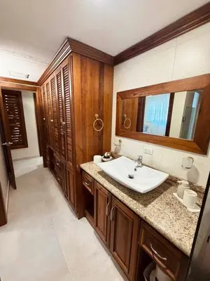 a bathroom with a sink and a mirror at Punta Cana Apartment Tropical Escape near Beach in Punta Cana