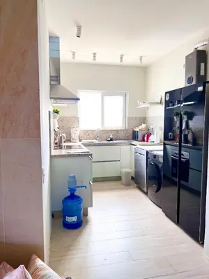 a kitchen with a refrigerator and a sink at 2Bedroom Apt Pool Beach Restaurants in Punta Cana