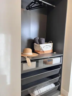 a walk in closet with a hat and towels at 2Bedroom Apt Pool Beach Restaurants in Punta Cana