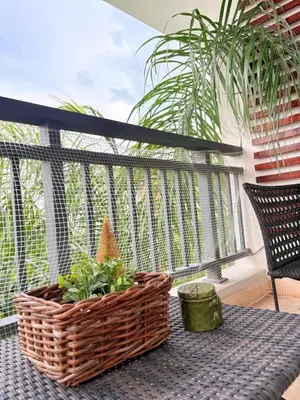 a wicker basket on a table with plants on a balcony at 2Bedroom Apt Pool Beach Restaurants in Punta Cana