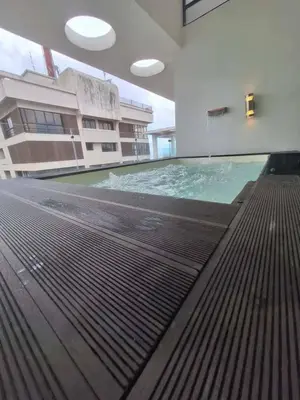 an empty swimming pool in a building at Miraculus Penthouse With Private Jacuzzi in Santo Domingo