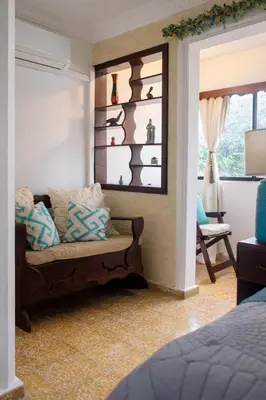 a living room with a couch and a window at Puerto Plata Home in San Felipe de Puerto Plata