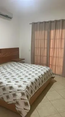 a large bed in a room with a window at Villa 156, 3 bedrooms and 3 bathrooms with private pool in Sosúa