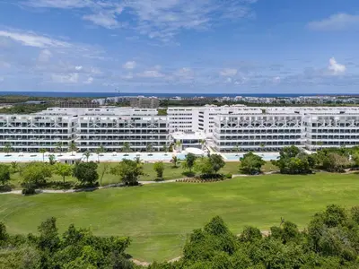an aerial view of a large white building at Vista Jade Apartamento 2 Hab Vista Picina y Golf in Punta Cana