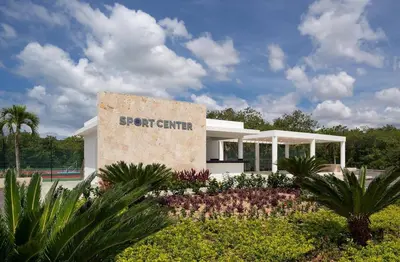 a building with a sign for a golf center at Beautiful 2 bedroom apartment Playa Nueva Romana in Boca del Soco