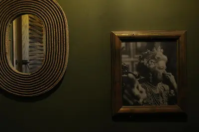 a mirror with a picture of a woman brushing her teeth at Casba Hostel in Las Terrenas