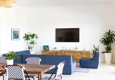 a living room with a couch and chairs and a tv at Private Villa-Infinity Pool-26 guests capacity-14 King Size Beds-8 bedrooms-8 and half baths in Cabrera