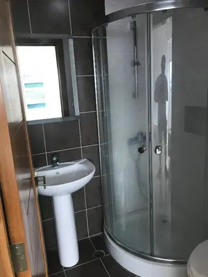 a bathroom with a shower and a sink at Eclectic 3 levels and 5 bedrooms penthouse in Santo Domingo