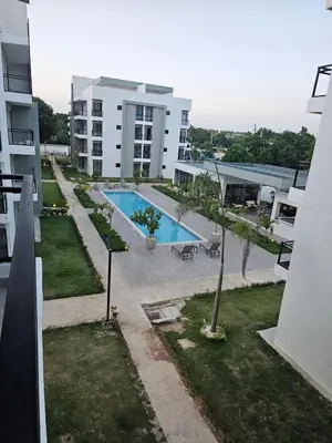 an aerial view of a swimming pool on a building at Romana Residence Vacationing Apartment in Cumayasa Kilómetros Diez