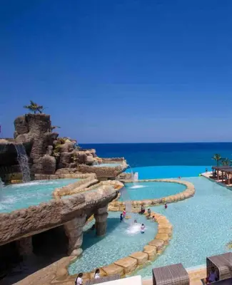 a pool at a resort with a water park at Boho Villa in Oceanfront Comm Sosua Ocean Village in Sosúa
