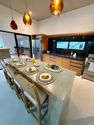 a table with plates of food on it in a kitchen at Coral Villa in Oceanfront Comm Sosua Ocean Village in Sosúa