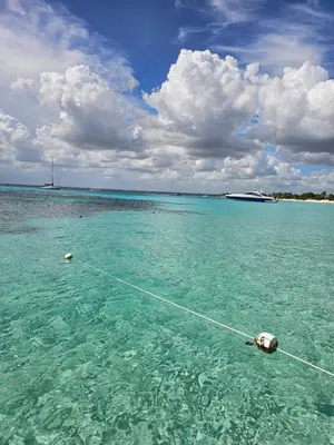a boat in the water in the ocean at Romana Residence Vacationing Apartment in Cumayasa Kilómetros Diez
