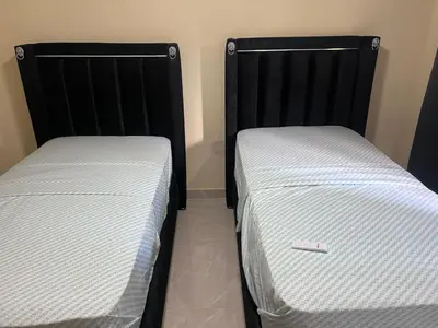 two beds sitting next to each other in a room at Mi refugio 2 in San Fernando de Monte Cristi