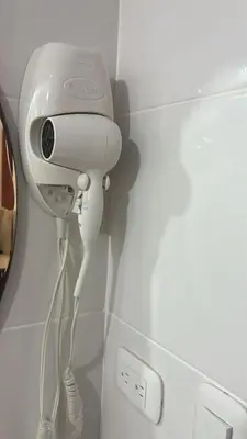 a hair dryer is attached to a wall at Cozy 3br apartment near to airport & beaches in La Cana
