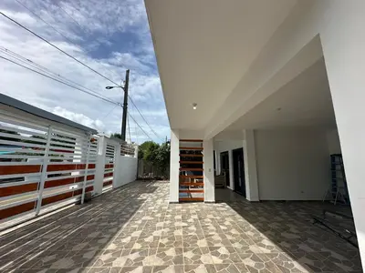 a balcony of a house with a building at Villa kiyana-14 pax, 5min de la playa en Las Galeras in Las Galeras