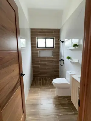 a bathroom with a toilet and a sink at Villa YOSYMART Poolside Retreat private WIFI Luxury BBQ side in Punta Cana