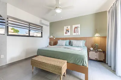 a bedroom with a bed and a ceiling fan at Kcasama Castle Villa 1108 in Sosúa