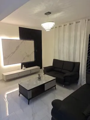 a living room with a couch and a coffee table at Residencial cayena del este Santo Domingo este in La Grúa