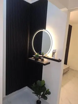 a bathroom with a mirror and a plant on a shelf at Residencial cayena del este Santo Domingo este in La Grúa