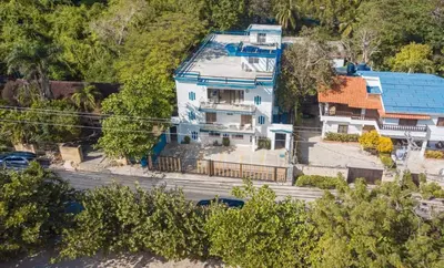 an aerial view of a large house in a city at beachfront apartment in La Puntica de Juan Dolio