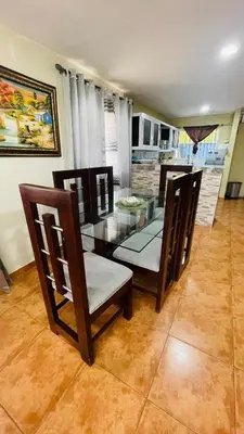 a dining room with a glass table and chairs at beachfront apartment in La Puntica de Juan Dolio