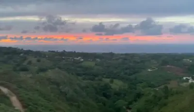 an aerial view of the ocean at sunset at Villa Brisa del Caribe in Las Terrenas