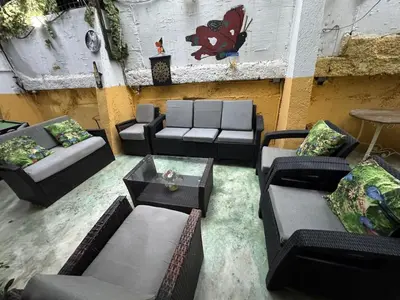 a living room with couches and a table at Apartamento en Santo Domingo Pablo mella morales in Hato Nuevo
