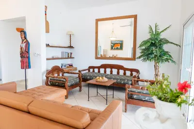 a living room with a couch and a table at Villa Playa Colorada Eco-Luxury Beachfront Retreat in La Colmena