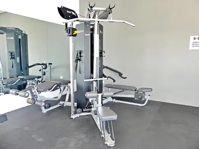 a gym with several tread machines in a room at Suite Panorama in Colorado