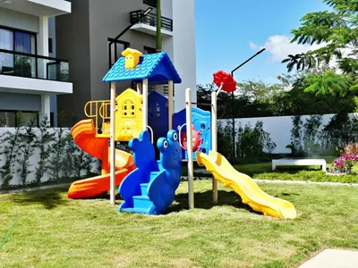 a group of playground equipment in a yard at Acogedor y Familiar in Colorado