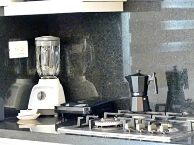 a kitchen stove with a blender on top of it at Con Estilo Soha II in Colorado