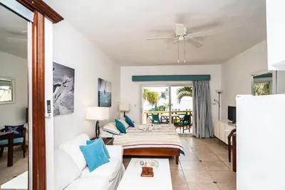 a living room with a couch and a table at Agualina Kite Hotel in Cabarete