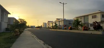an empty street with buildings on the side of the road at Seaside Elegance in Baní