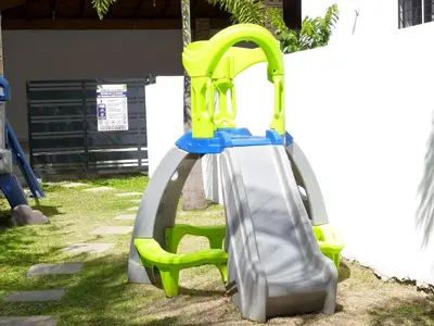 a playground with a slide in the grass at Aparta Plus 4th Nivel in Colorado