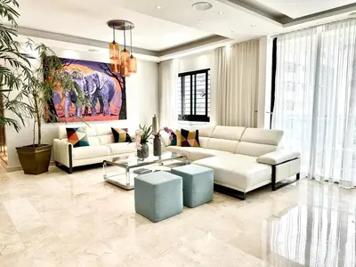a living room with white furniture and a painting at Villa Olga Premium in Colorado