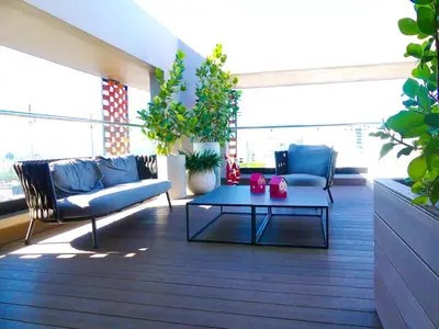 a living room with couches and a coffee table at Master Suite Rialto Residences in Colorado