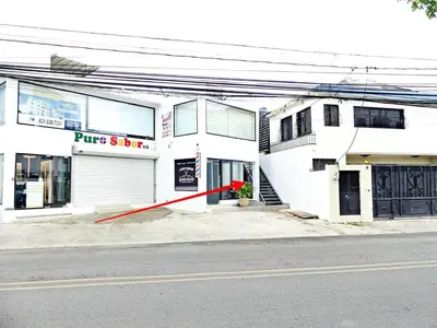 a white building with a red pole in front of it at Mini Hogar 4 in Colorado