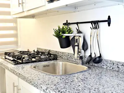 a kitchen counter with a sink and a stove at Mini Hogar 4 in Colorado