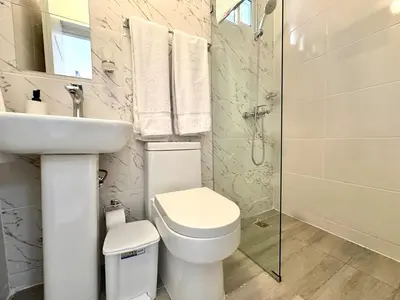 a bathroom with a toilet and a sink and a shower at Mini Hogar 2 in Colorado