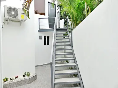 a staircase leading up to a white house at Mini Hogar 2 in Colorado