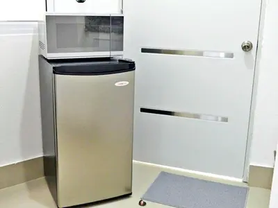 a refrigerator in a kitchen with a microwave at Mini Hogar 3 in Colorado