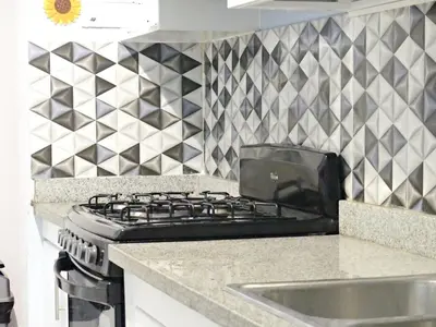 a kitchen counter with a stove and a sink at Cofresi, Puerto Plata in Colorado