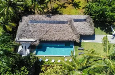 an aerial view of a house with a swimming pool at Nomadas 5 bdrs villa with private pool 2nd line to beach in Las Terrenas